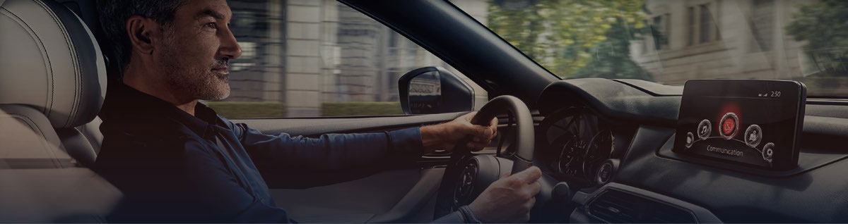 Man Driving Mazda Vehicle